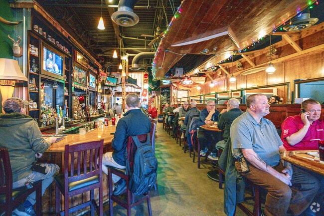 The Boathouse Grill in Snacks/Guion Creek has a pub menu and a boat hanging from the ceiling.