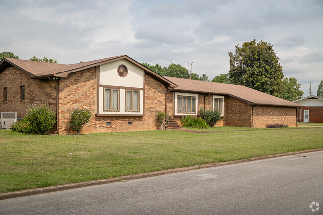 This Woodmore rancher features a largely brick facade.