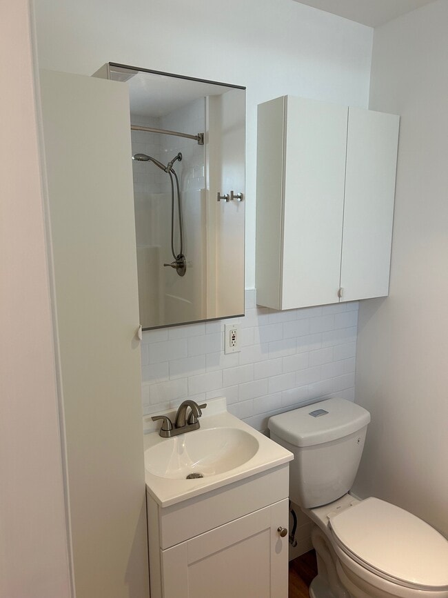 bathroom with storage closet
