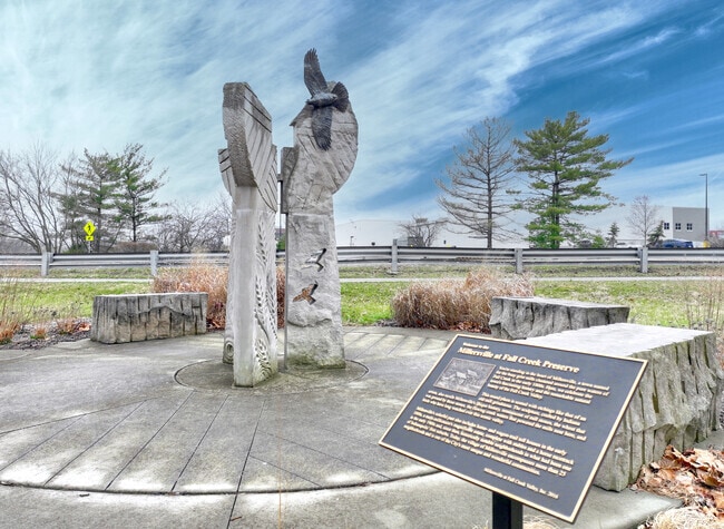 A large statue and historical plaque stands at the Fall Creek Preserve in Millersville.