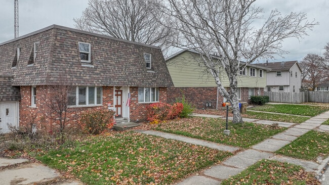 Duplexes are common on this tree-lined McKinley street.
