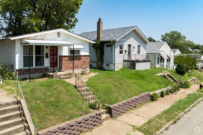 Hi-Pointe neighborhood showcases traditional bungalows with pitched roofs and tidy yards.