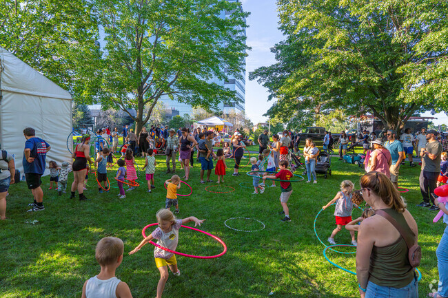 Kids hula hoop at the Bloomington Summer Fete.