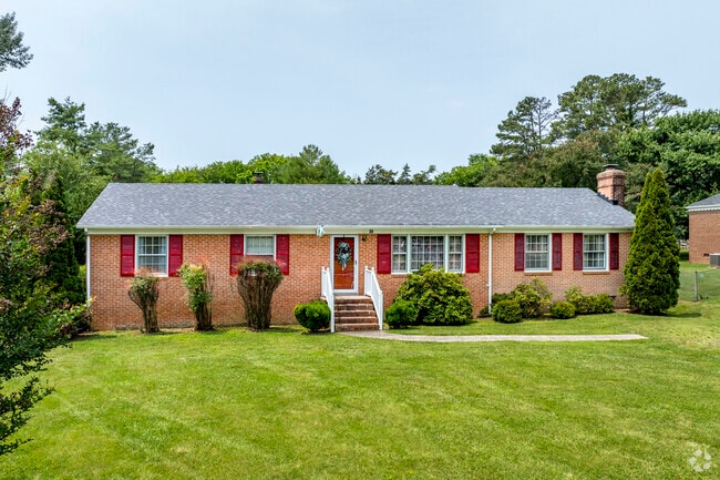 A brick ranch home with a well-manicured yard is typical of Cumberland's housing style.