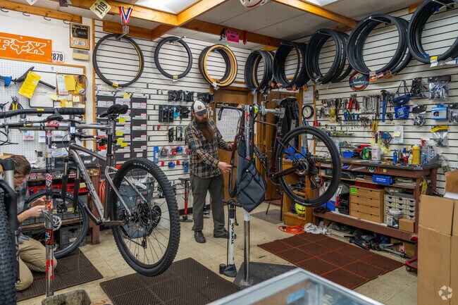 There is a bike repair shop near the Five Mile neighborhood.