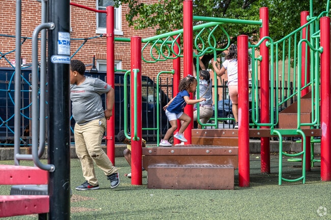 Play with friends at the playground in Hollins Market.