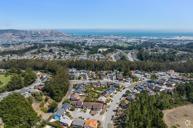 Enjoy breathtaking views of the Bay Area from Portola Highlands, a tranquil hilltop community.
