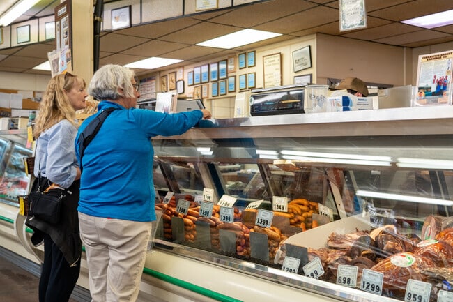 Locals gather at Corralitos Market & Sausage Company to shop for house-smoked sausages and fresh cuts.