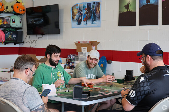 Friends regularly gather at Away Games in Gloucester Crossing to dive into imaginative worlds through tabletop role-playing games, creating adventures and memories.