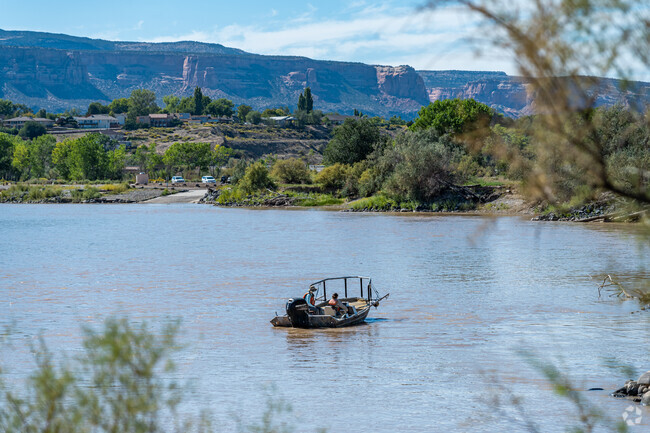 Enjoy boaters cruising by on the Colorado River from the Junior Service League Park.