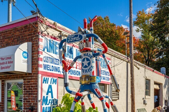 Unique muffler artwork lines the sidewalk along Park Avenue in Knightsville.