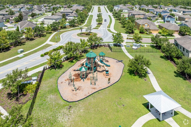 Outdoor amenities are part of the lifestyle, including playgrounds in Long Lake Ranch, FL.