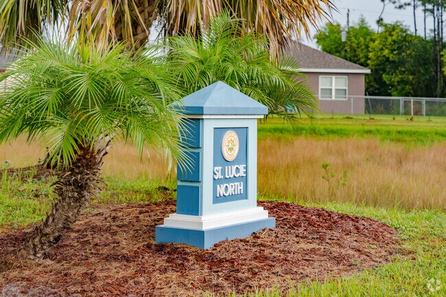 Residents are welcomed by the Saint Lucie North entrance sign, a gateway to golf and nature.