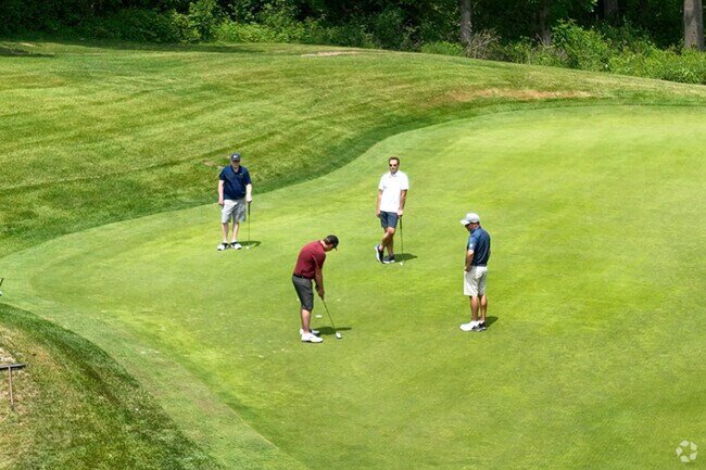 A foursome shooting a Par 3 at Gem Lake Hills Golf Course.