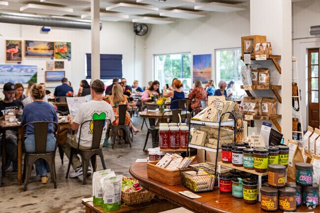 The Tides offers fresh seafood entrees and a gourmet market near Del Oro Groves.