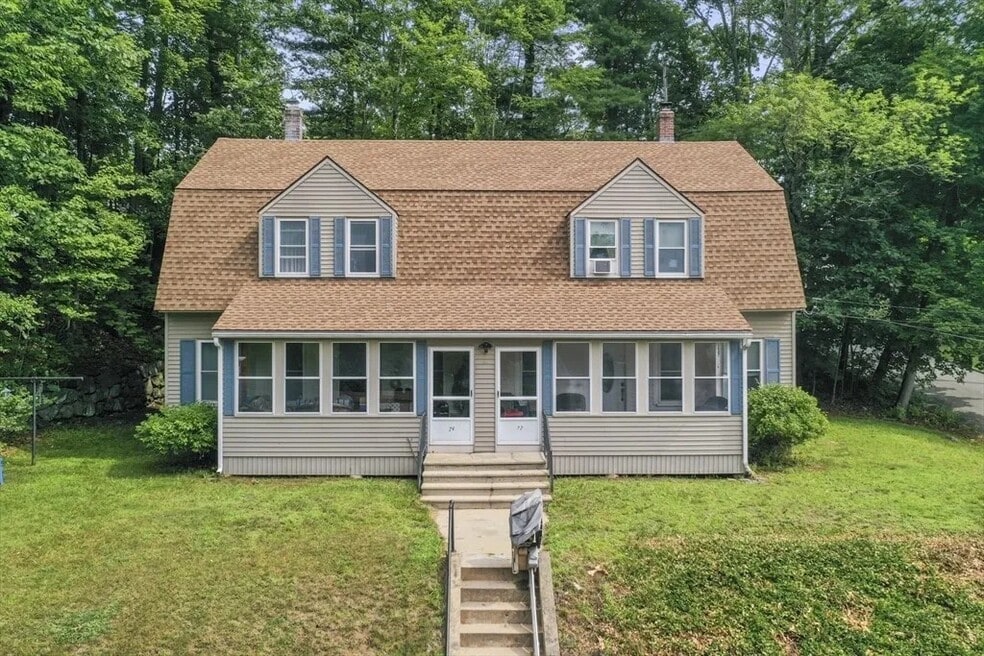 Unit is on the right with wooded lot/yard and private deck