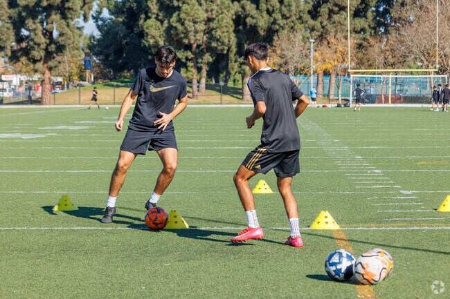 Smith Park in Pico Rivera has an all weather soccer pitch and baseball and basketball too.