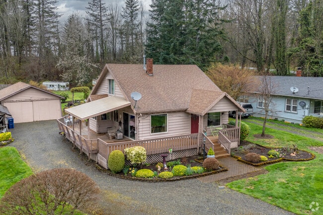 Craftsman-inspired farmhouses with front porches, pointed roofs and multiple front gables tend to come with acreage.