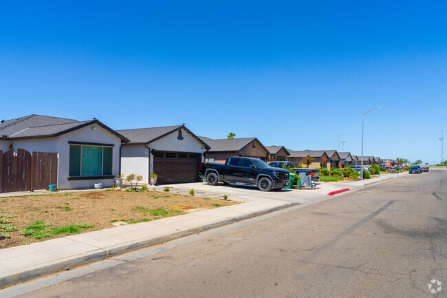 Sidewalks connect rows of homes in San Joaquin’s quiet neighborhoods.