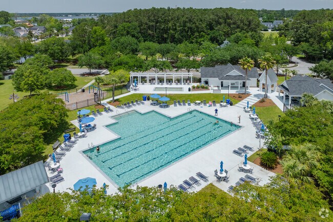 Residents in Rivertowne enjoy having family fun in the sun at the Amenity Center swimming pool.