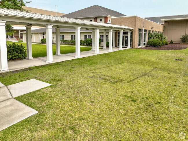Students walk down a shaded entrance to Palmetto Christian Academy Mount Pleasant, S.C.