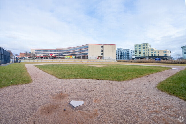 A little league baseball field sits next to the Garfield Elementary School in Revere, MA.