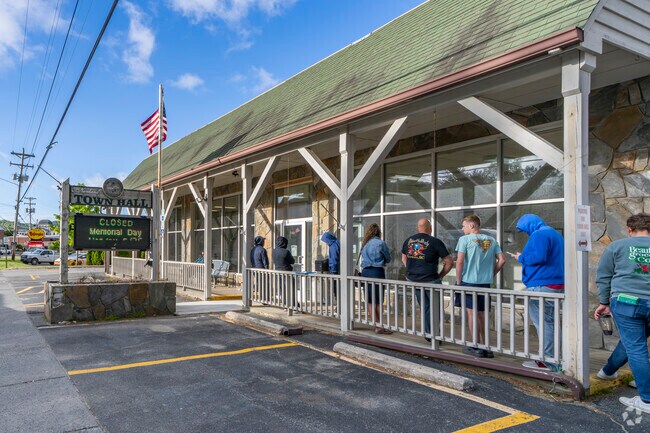 Engage with a proactive community—attend town meetings, voice concerns, and stay informed at Newland's central civic hub.