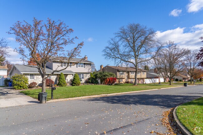 Split-level and colonial-style homes line tree-shaded streets in Hanover Township Northampton.
