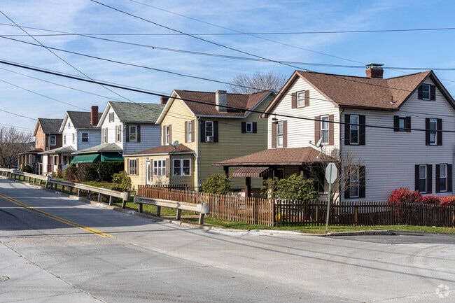 Farmhouse-style homes line rural roads, reflecting Sewickley Township’s heritage.