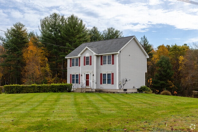 Center hall colonial homes with large front yards are common in Northeast Nashua, NH.