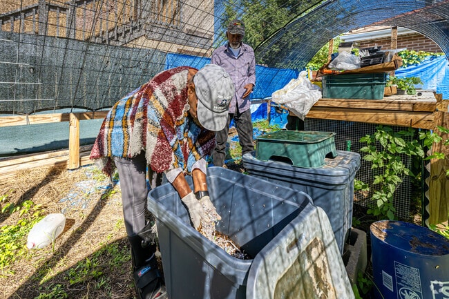 Dixon residents work hard in the community garden.
