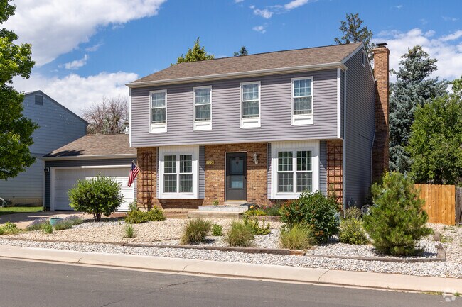 This Centre Pointe Colonial home boasts amazing brick work and a xeriscaped front yard.