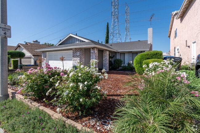 Colorful blooms frame the charming homes that line the streets of Mission Hills.