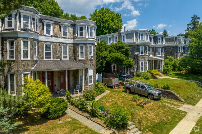 3 story stone colonial style duplexes offer affordable living options in Wissahickon.