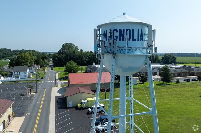 The Magnolia water tower stands above a quiet townscape of homes and businesses just south of Dover.