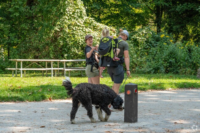 Dog-walkers enjoy the space Ira Trailhead offers in the Cuyahoga Valley National Park.