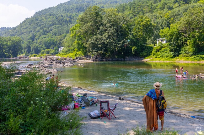 Paine’s Beach offers a peaceful spot for swimming and sunbathing along the White River.