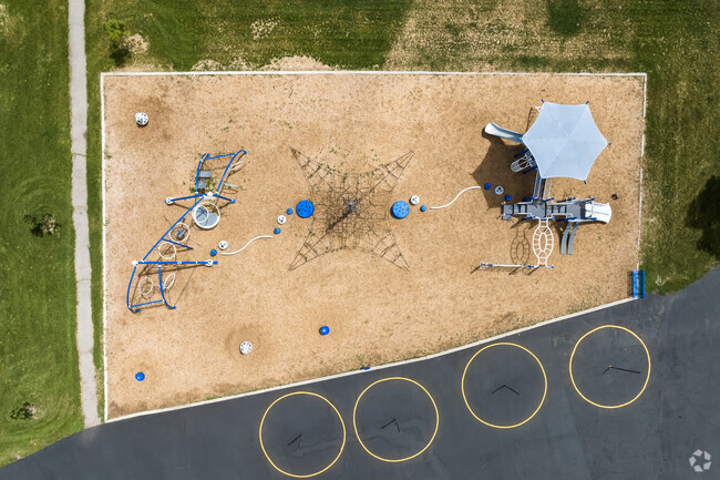 An interesting playground at McMillan Elementary School is painted in shades of blue and white.