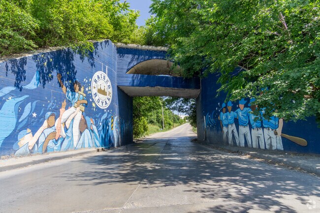 A colorful mural greets visitors on the bridge into Leeds.
