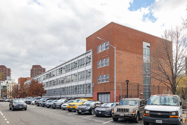M372 Esperanza Preparatory Academy is in a busy area of Harlem, New York City.