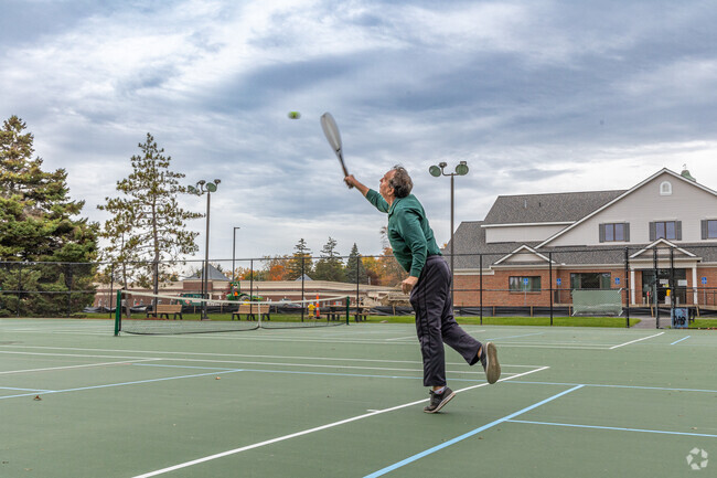 A Washington Township resident practices their tennis serve at the park.