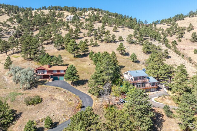 Cabin-inspired homes offer cozy, tranquil living with easy access to the trails in Foothills.