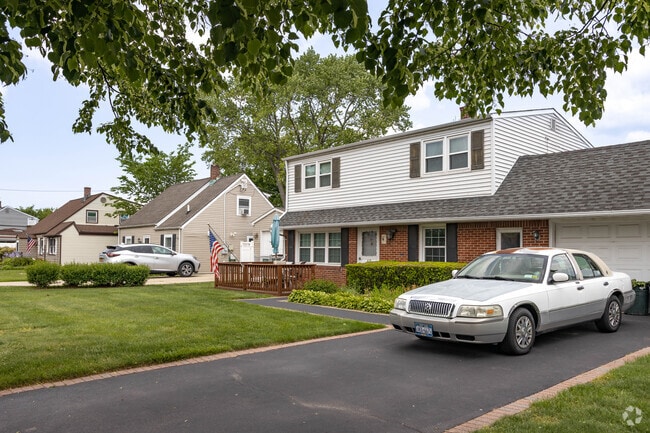 Many of Levittown's original Cape Cods have had second levels added.