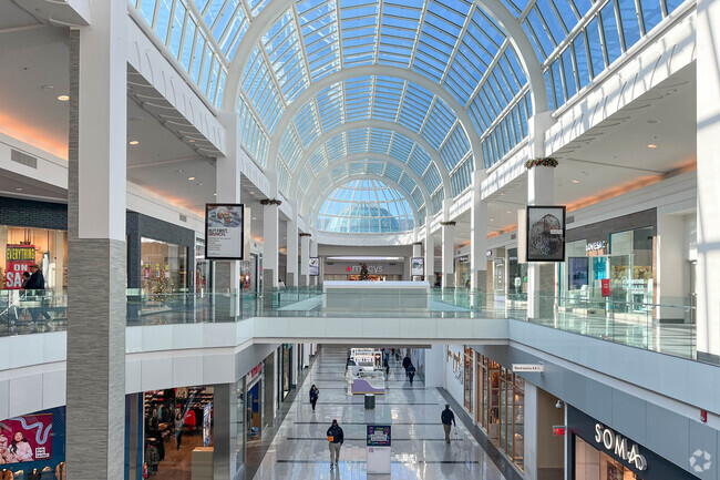 The glass ceiling at the Nearby Roosevelt Field Mall makes the mall light, airy.