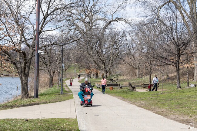 The lakeside walking trails are very popular in Powderhorn Park.