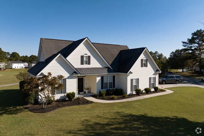 Homes on corner lots in Rincon feature side entry garages hidden from the front.