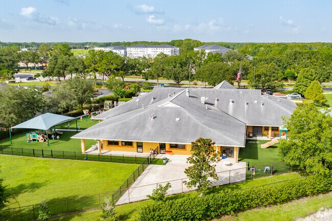 Kids enjoy playing on the play area at Discovery Point - Lexington Oaks.