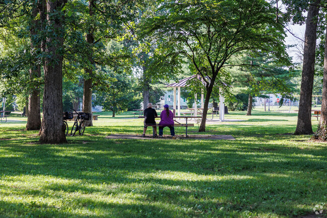 Locals take a few moments to enjoy the beauty and serenity of Washington Park.