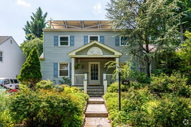 Colonial homes with mature trees add charm to Highland Park.Park, New Jersey.