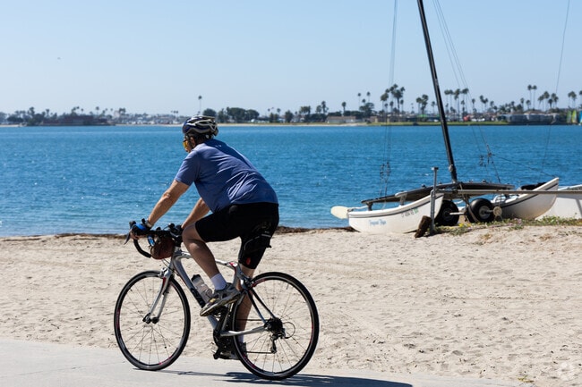 A man rides his bicycle near Fanel Street Park.
